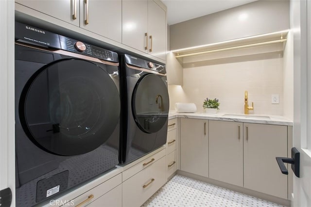 4 Sunset Cv, Newport Coast, CA 92657 - washroom featuring light floors, washing machine and dryer, a sink, and cabinet space