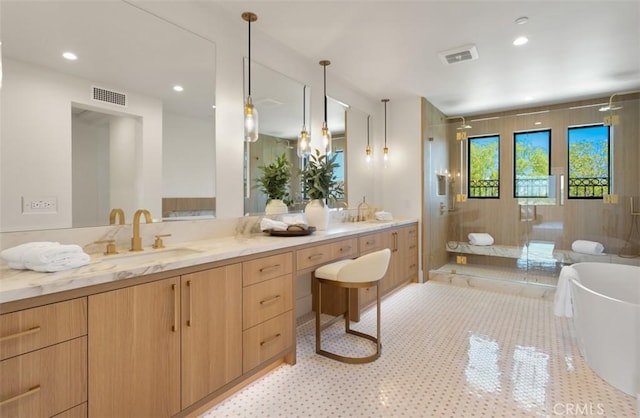 4 Sunset Cv, Newport Coast, CA 92657 - full bathroom featuring double vanity, a stall shower, a sink, visible vents, and a freestanding tub
