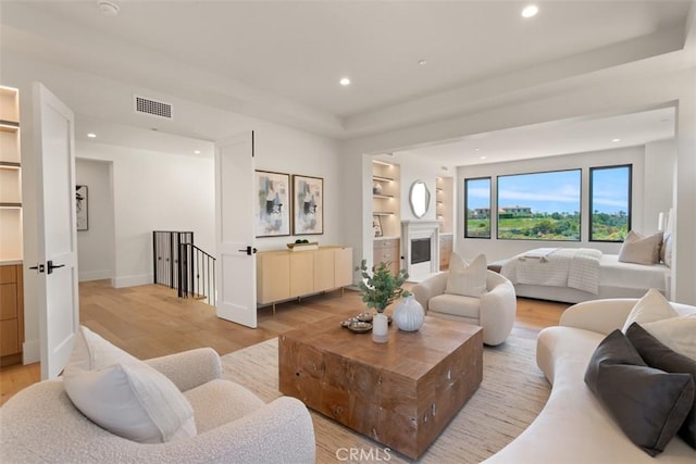 4 Sunset Cv, Newport Coast, CA 92657 - living room with light wood-type flooring, visible vents, built in shelves, recessed lighting, and baseboards
