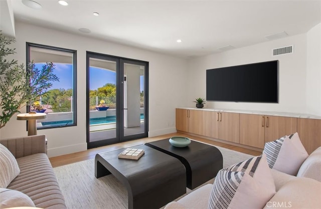 4 Sunset Cv, Newport Coast, CA 92657 - living area with light wood-type flooring, visible vents, baseboards, and recessed lighting