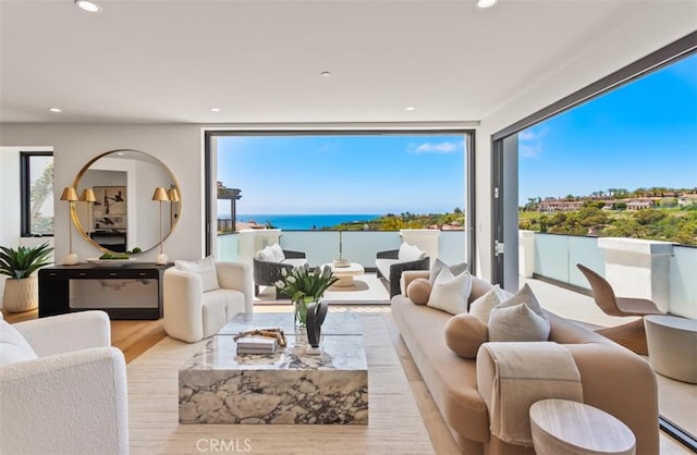 4 Sunset Cv, Newport Coast, CA 92657 - living area featuring a wealth of natural light, recessed lighting, and wood finished floors