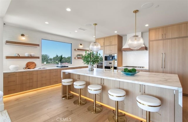 4 Sunset Cv, Newport Coast, CA 92657 - kitchen featuring open shelves, modern cabinets, light wood-style flooring, and light brown cabinets
