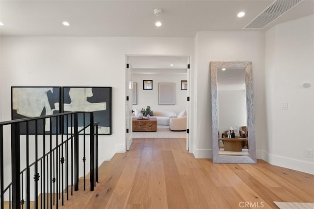 4 Sunset Cv, Newport Coast, CA 92657 - hall with light wood-type flooring, an upstairs landing, visible vents, recessed lighting, and baseboards