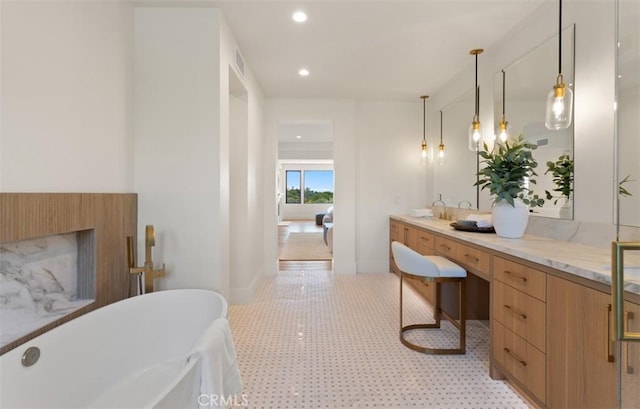 4 Sunset Cv, Newport Coast, CA 92657 - full bathroom featuring a fireplace, a freestanding bath, visible vents, vanity, and recessed lighting