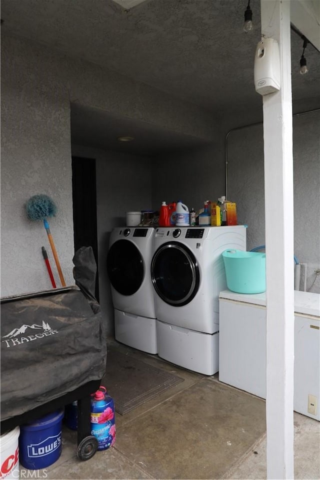 laundry room with washer and clothes dryer and laundry area