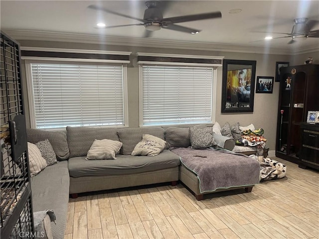 living area featuring light wood finished floors, a ceiling fan, and ornamental molding