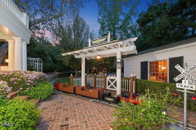 view of patio terrace at dusk
