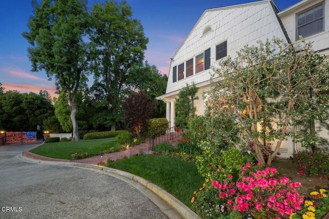 view of side of property featuring a lawn