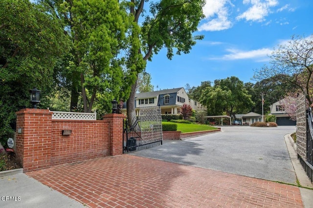 view of gate with fence