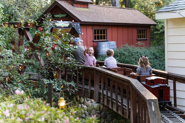 exterior space with an outdoor structure and a wooden deck