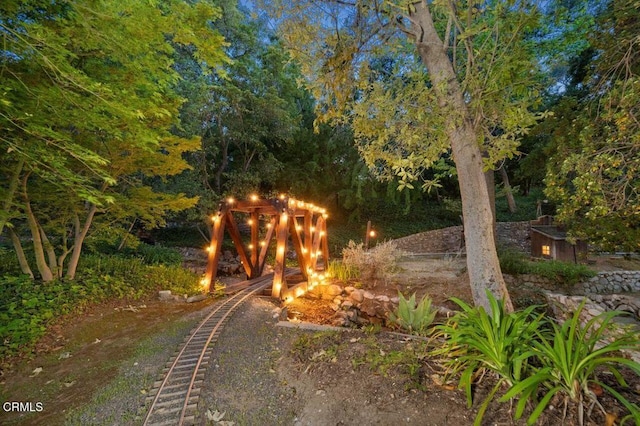view of community featuring an outdoor fire pit