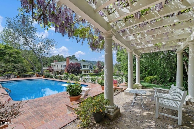 outdoor pool featuring a patio area and a pergola