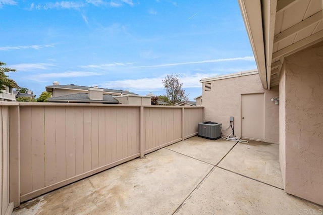 view of patio / terrace featuring cooling unit and fence