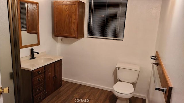 31194 Outer Highway 18 N, Running Springs, CA 92382 - bathroom featuring toilet, vanity, wood finished floors, and baseboards