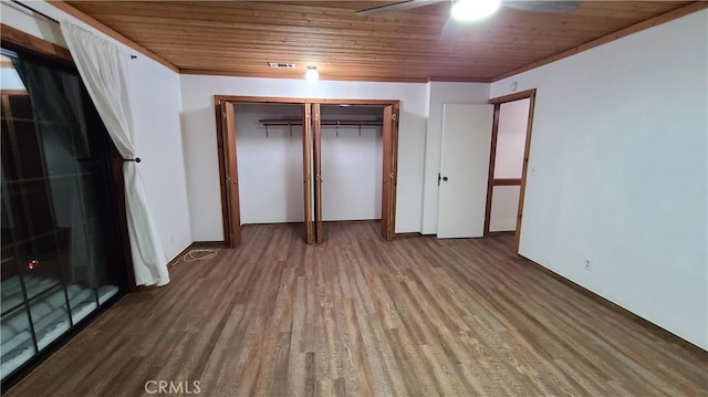 31194 Outer Highway 18 N, Running Springs, CA 92382 - unfurnished bedroom featuring wood finished floors, wooden ceiling, a closet, and a ceiling fan