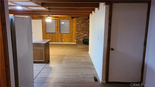 31194 Outer Highway 18 N, Running Springs, CA 92382 - hallway with wooden walls, baseboards, and light wood-type flooring
