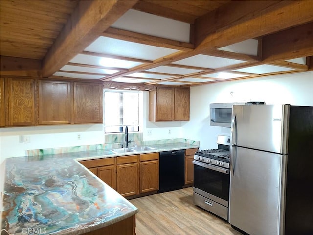 31194 Outer Highway 18 N, Running Springs, CA 92382 - kitchen with appliances with stainless steel finishes, a sink, light wood-type flooring, brown cabinetry, and light countertops