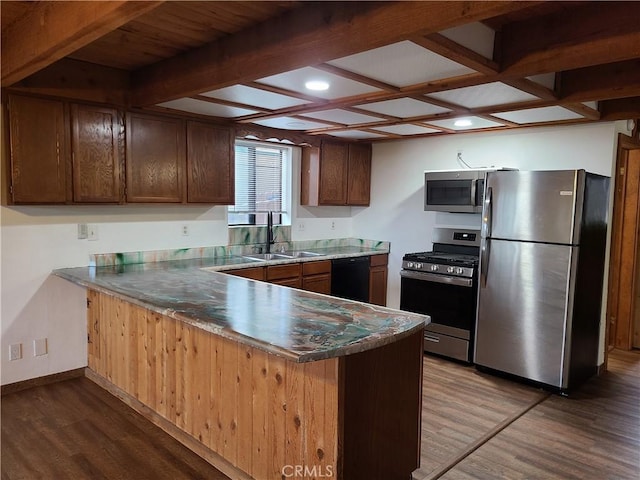 31194 Outer Highway 18 N, Running Springs, CA 92382 - kitchen featuring stainless steel appliances, a sink, a peninsula, wood finished floors, and baseboards