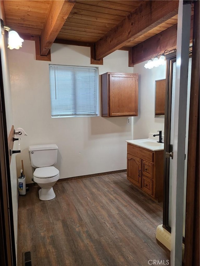 31194 Outer Highway 18 N, Running Springs, CA 92382 - bathroom with wooden ceiling with exposed beams, toilet, vanity, wood finished floors, and baseboards