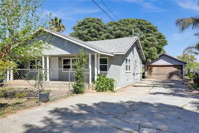 3001 N State St, San Bernardino, CA 92407 - bungalow with an outdoor structure, a garage, stucco siding, a shingled roof, and a porch