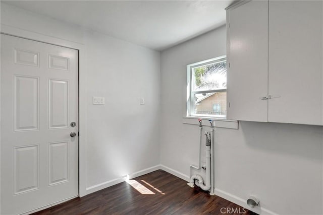 3001 N State St, San Bernardino, CA 92407 - laundry area featuring dark wood-style flooring and baseboards