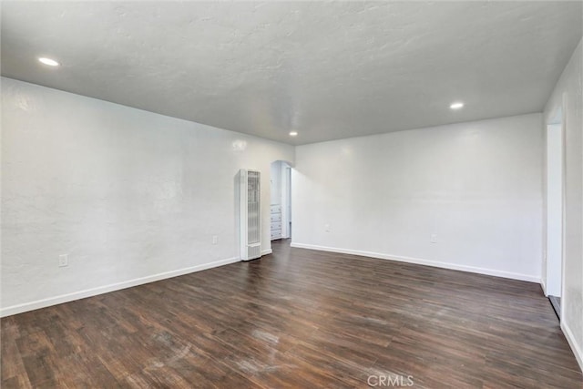 3001 N State St, San Bernardino, CA 92407 - spare room with baseboards, dark wood-style flooring, and recessed lighting