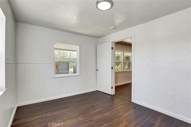 3001 N State St, San Bernardino, CA 92407 - unfurnished room featuring a wainscoted wall, wood finished floors, and baseboards