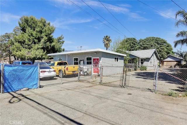 3001 N State St, San Bernardino, CA 92407 - ranch-style house with stucco siding, fence private yard, and a gate