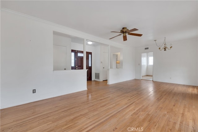 unfurnished living room with crown molding, light wood-style floors, visible vents, and ceiling fan with notable chandelier