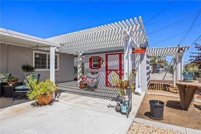 25805 Musselburgh Dr, Menifee, CA 92586 - doorway to property with a pergola, a patio, stucco siding, and fence