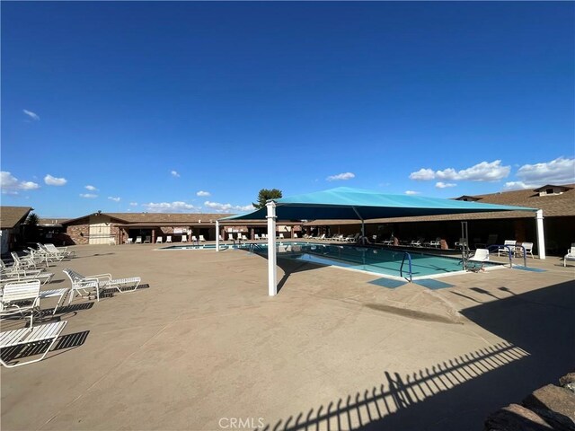 25805 Musselburgh Dr, Menifee, CA 92586 - community pool with a patio area