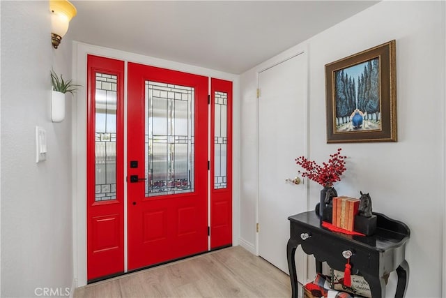 25805 Musselburgh Dr, Menifee, CA 92586 - entryway with light wood-style flooring and baseboards