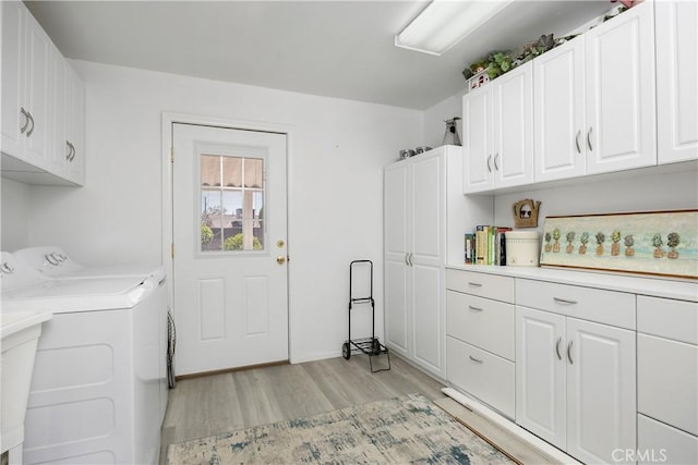 25805 Musselburgh Dr, Menifee, CA 92586 - laundry area with cabinet space, separate washer and dryer, and light wood-type flooring