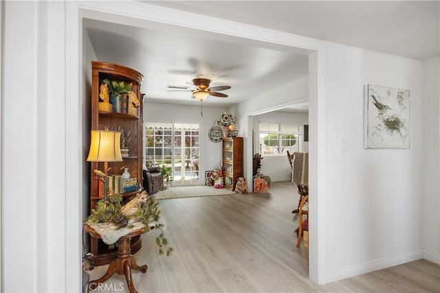 25805 Musselburgh Dr, Menifee, CA 92586 - foyer featuring wood finished floors and a ceiling fan