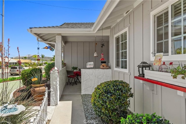 25805 Musselburgh Dr, Menifee, CA 92586 - entrance to property with board and batten siding, a porch, and roof with shingles