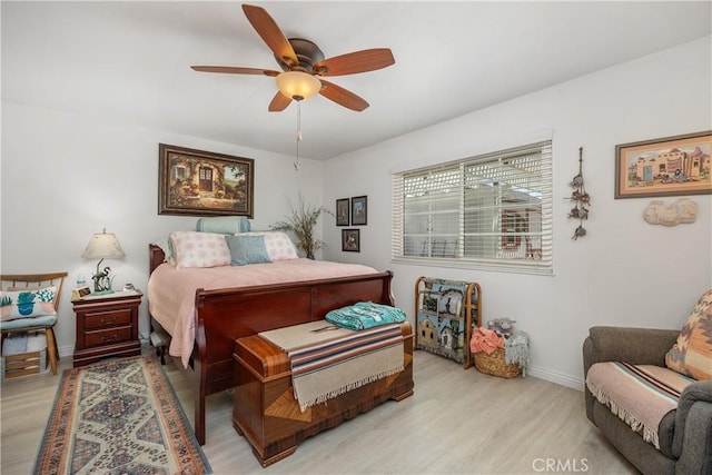 25805 Musselburgh Dr, Menifee, CA 92586 - bedroom with light wood-style floors, baseboards, and ceiling fan