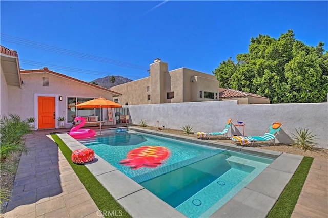 54345 Avenida Carranza Ln, Quinta, CA 92253 - view of swimming pool with a patio area, a fenced in pool, and a fenced backyard