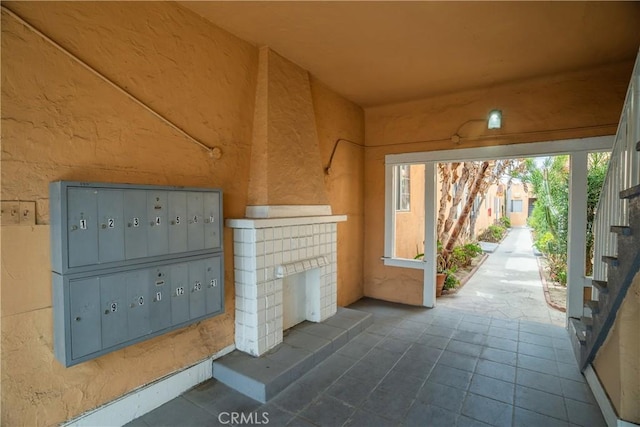 view of home's community featuring mail area