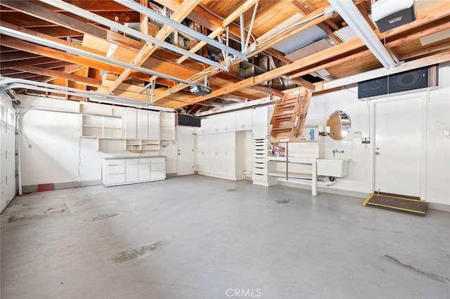 1206 Arno Dr, Sierra Madre, CA 91024 - garage with baseboards, a garage door opener, and a sink