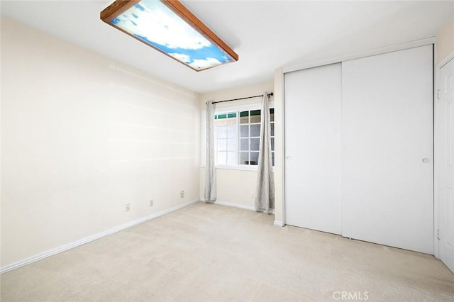 1206 Arno Dr, Sierra Madre, CA 91024 - unfurnished bedroom featuring a closet, light colored carpet, and baseboards