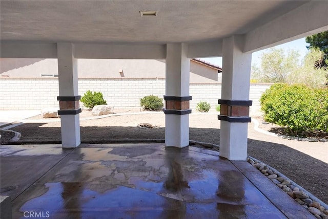 view of patio / terrace featuring fence