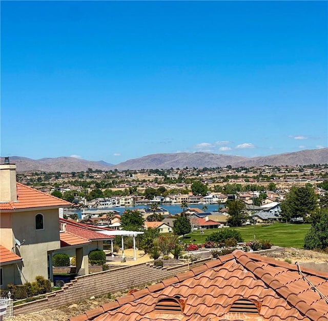 view of mountain background with nearby suburban area