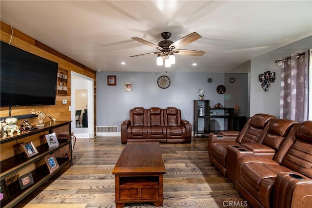 living room featuring wood finished floors, a ceiling fan, visible vents, and recessed lighting