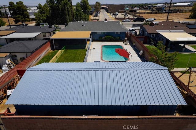 view of pool with a fenced backyard, a fenced in pool, and a residential view
