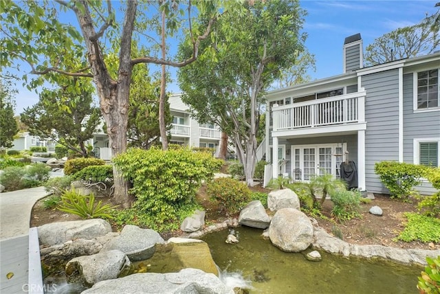 exterior space with a small pond