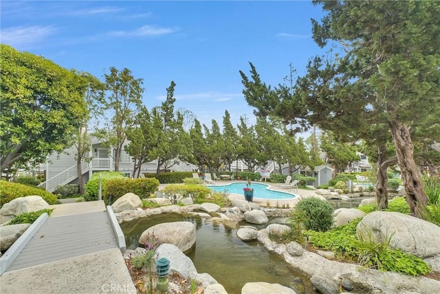 view of home's community with a pool