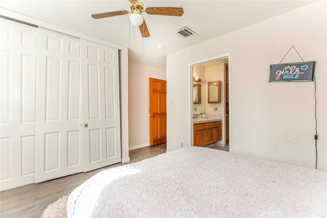 9653 La Tuna Canyon Rd, Sun Valley, CA 91352 - bedroom with ensuite bathroom, a closet, visible vents, and wood finished floors