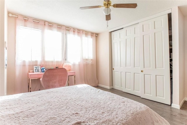 9653 La Tuna Canyon Rd, Sun Valley, CA 91352 - bedroom with a closet, wood finished floors, baseboards, and a ceiling fan