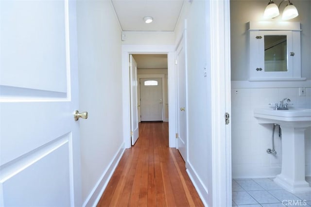 corridor featuring light wood-style flooring