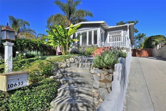 view of front of home with fence